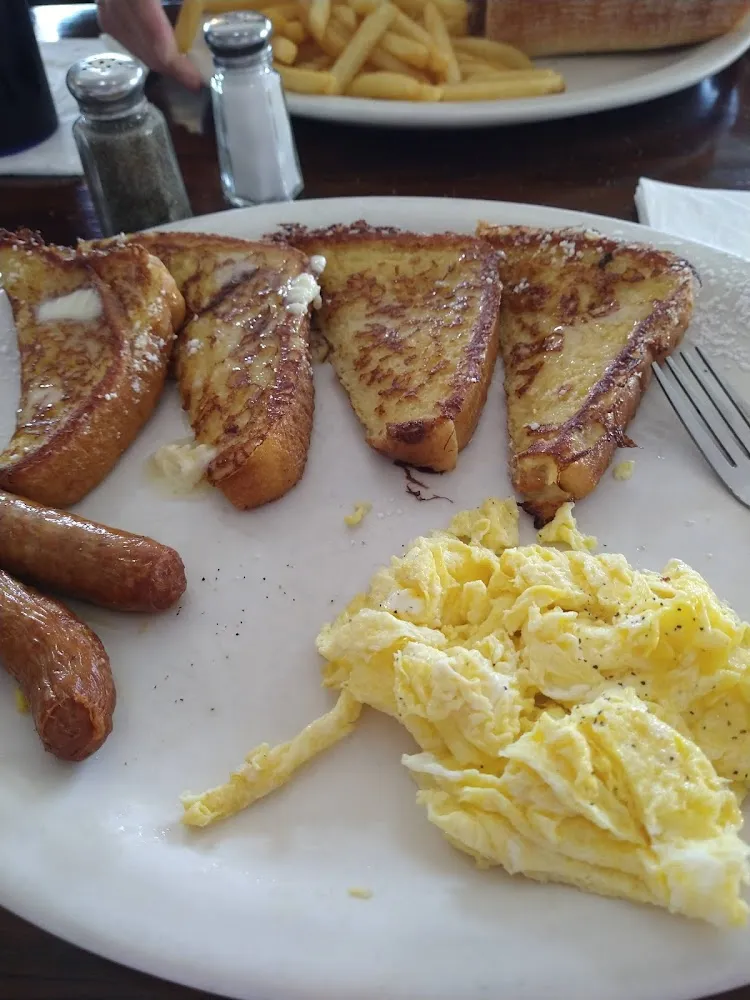 352 Breakfast a Choice of 2 Eggs 2 Meat and 2 French Toast or Pancakes